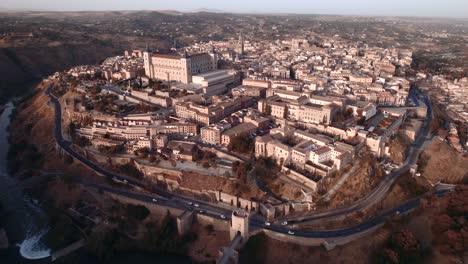 a drone shot of toledo at sunrise