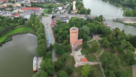 medieval tower boom crane aerial island lake water countryside