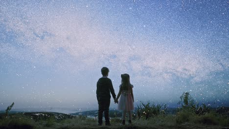 children gazing at the milky way