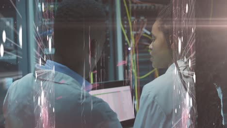 Animation-of-lights-over-african-american-man-and-woman-working-in-server-room