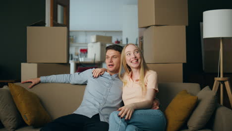 family enjoy purchased house sitting couch closeup. owners happy buying property