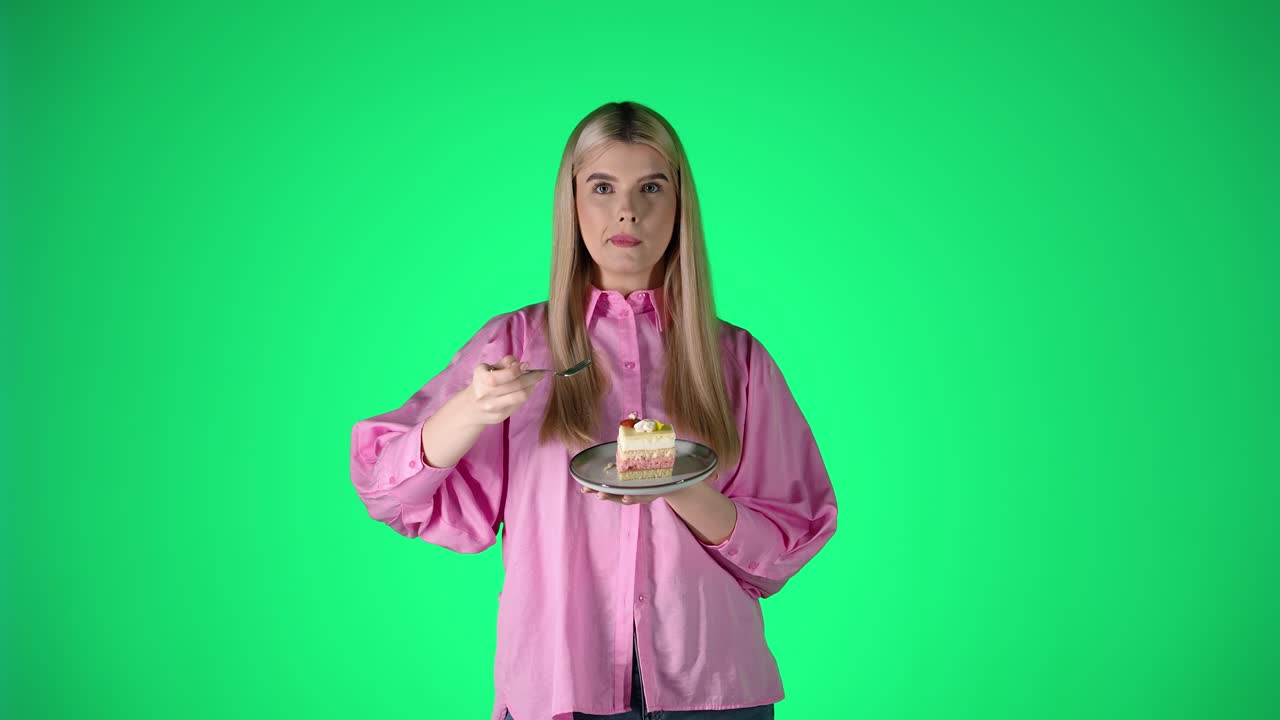 Young Woman Enjoying a Delicious Piece of Cake