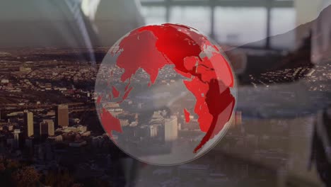 Animation-of-globe-and-business-people-shaking-hands-over-cityscape