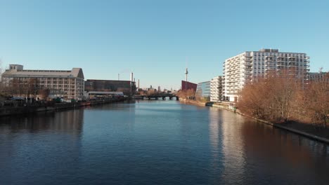 berlin wall from the river spree with a drone flying along the river and showing the berlin tv antenna made in 4k 24fps