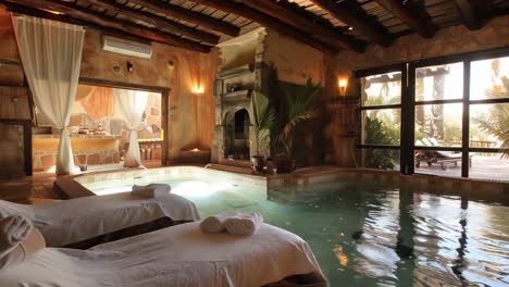 indoor spa with jacuzzi and massage table