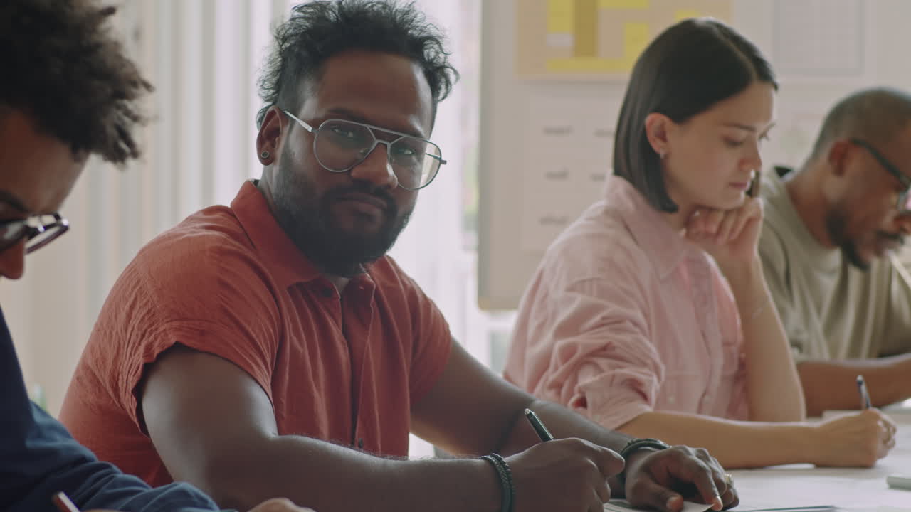 Portrait of Young Man on Study in School for Migrants