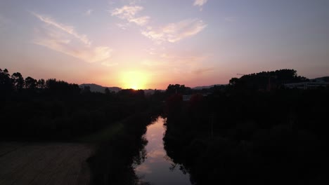 Aerial-View-of-Misty-River-at-Sunset