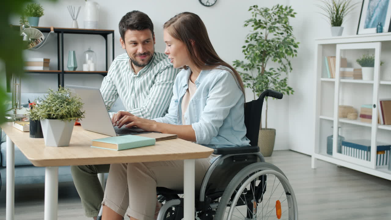 Couple Working Together at Home on Laptop