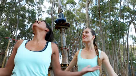 Two-woman-hugging-each-other-near-zip-line-4k