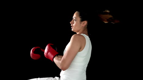 Brunette-kicking-in-boxing-gloves