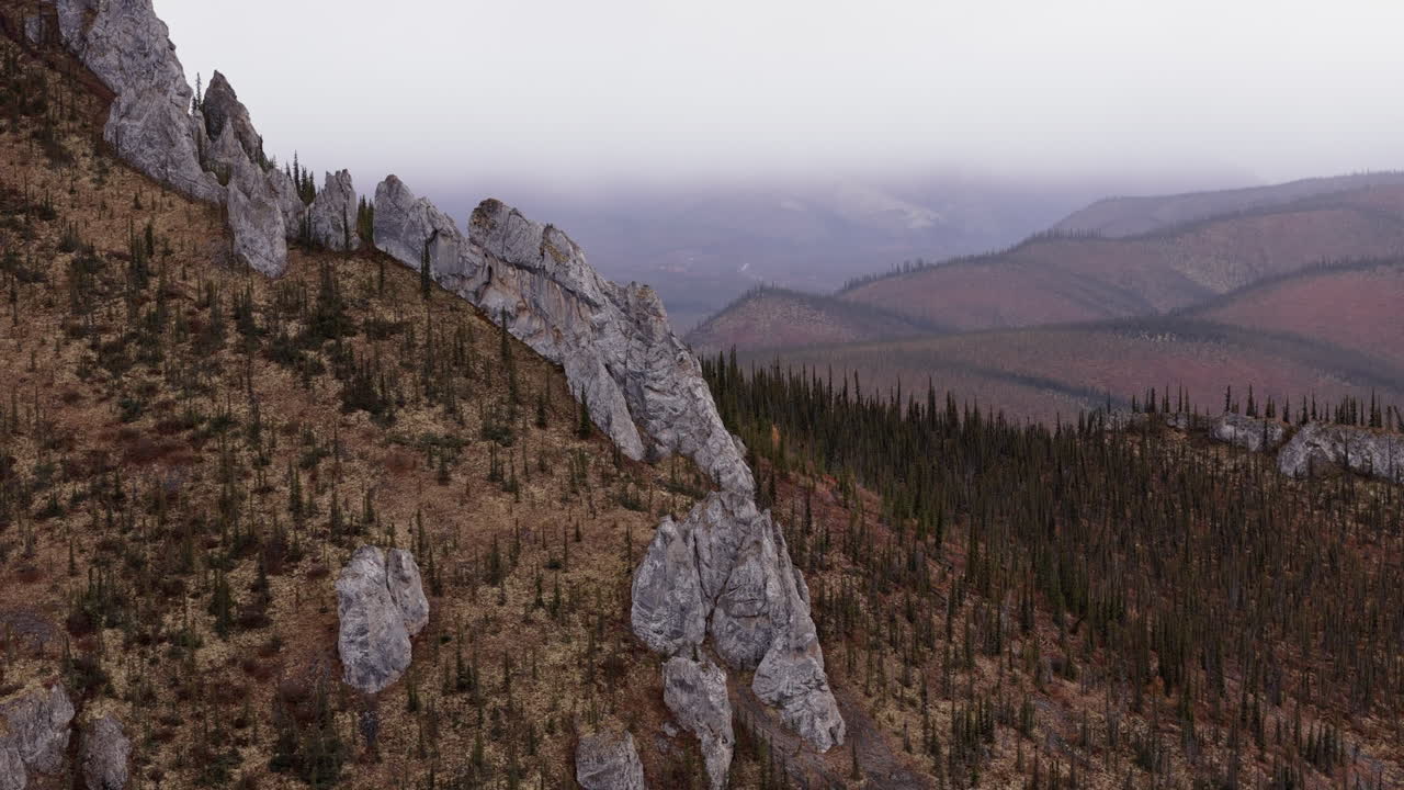 Rocky Outcrops On Sapper Hill With Autumn Foliage. Yukon Territory, Canada. drone shot
