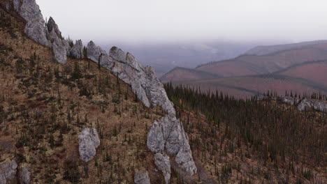 Rocky Outcrops On Sapper Hill With Autumn Foliage. Yukon Territory, Canada. drone shot
