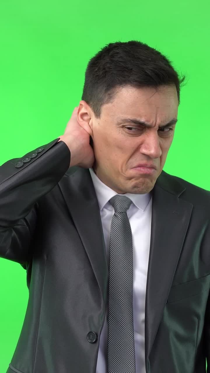 Businessman Reacting with Disgust and Confusion on Green Screen