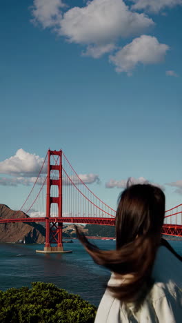woman admiring the golden gate bridge in san francisco