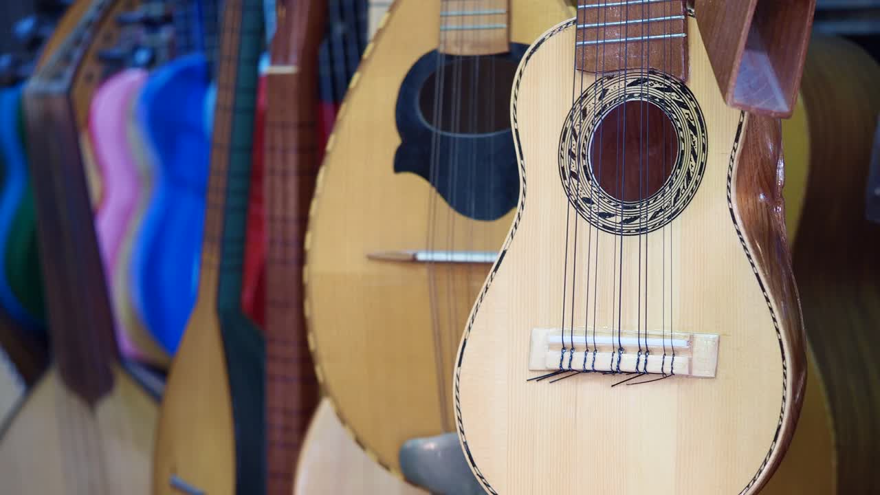Row of traditional charango-like string instruments