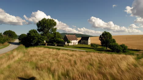scenic farmhouse in a wheat field