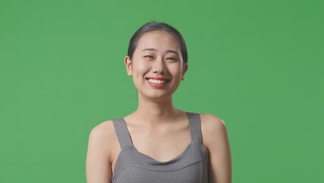 happy woman smiling in studio