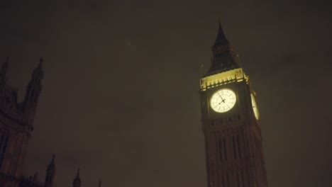 big ben clock in westminster, london in the united kingdom. the camera shows the clock face lit up at night. produced in 4k, 50 frames per second and in rec709 color space.
