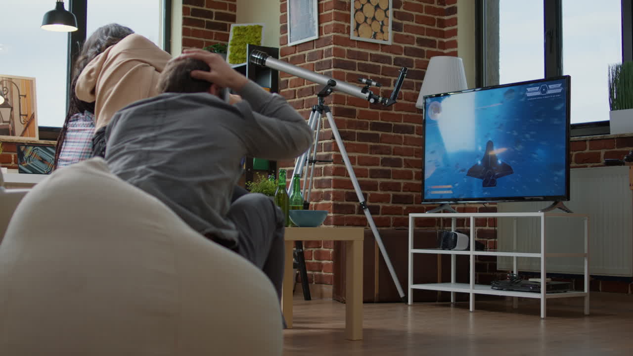 Friends playing online action video games on console game