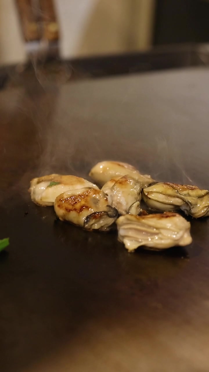 Fresh Oysters Searing on a Hot Teppanyaki Grill