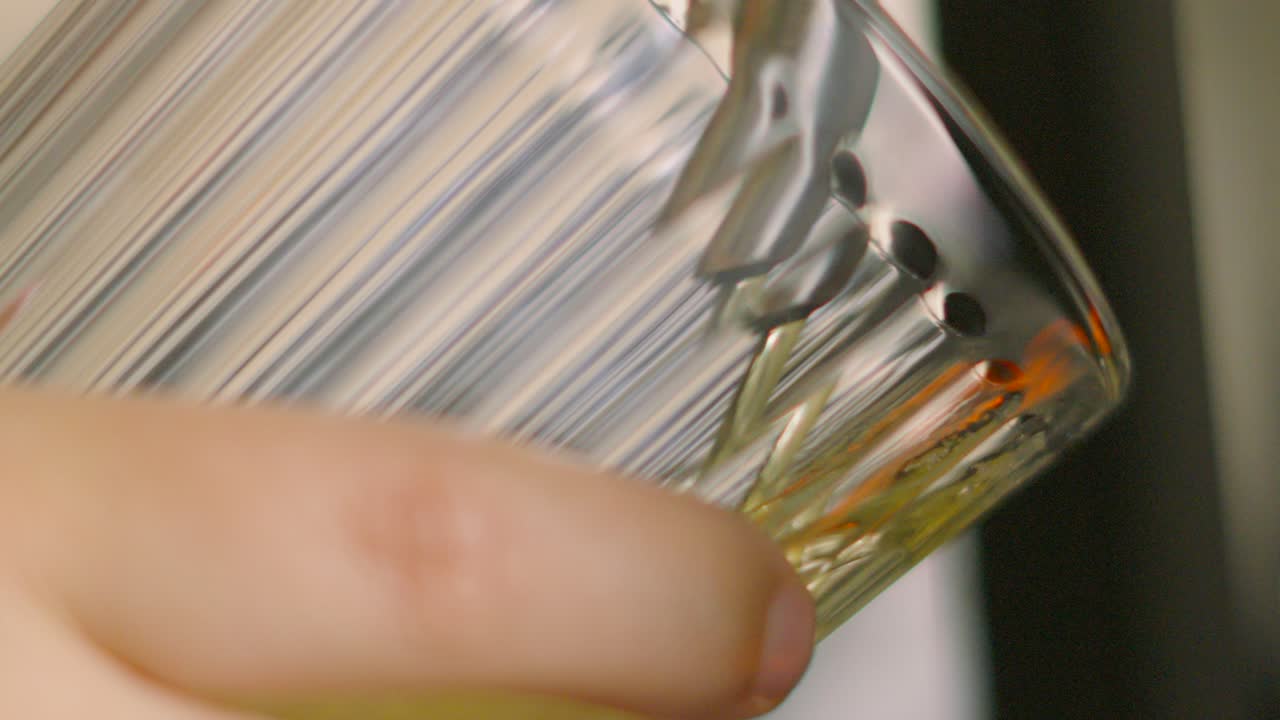 Hand Holding Glass Pouring Beer from Lager Tap into Glass. Close Up of Cool Chilled Alcoholic Beverage Drink Poured in Bar