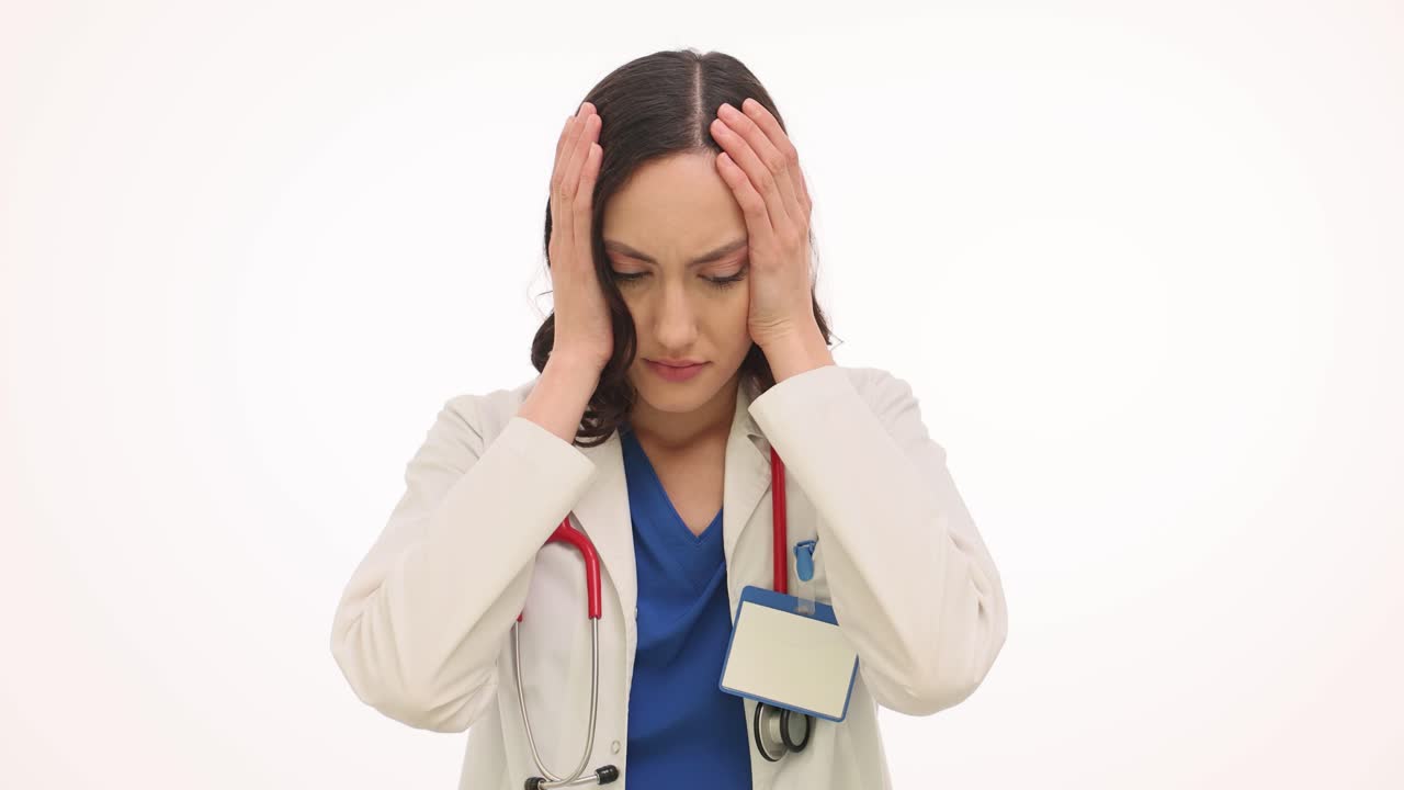 Stressed Female Doctor Suffering from Headache or Burnout