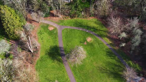 4k aerial drone shot overlooking a public park rising into portland, oregon scenery