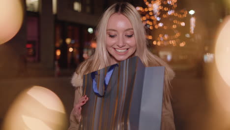 young woman handed christmans present but is really dissapointed with the gift - in slow motion