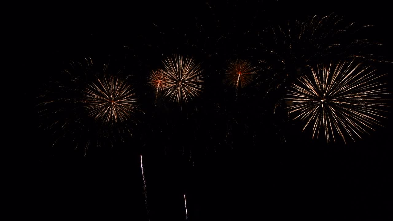 Long time seamless loop of real colourful fireworks festival display at night during national holiday, new year party 2022