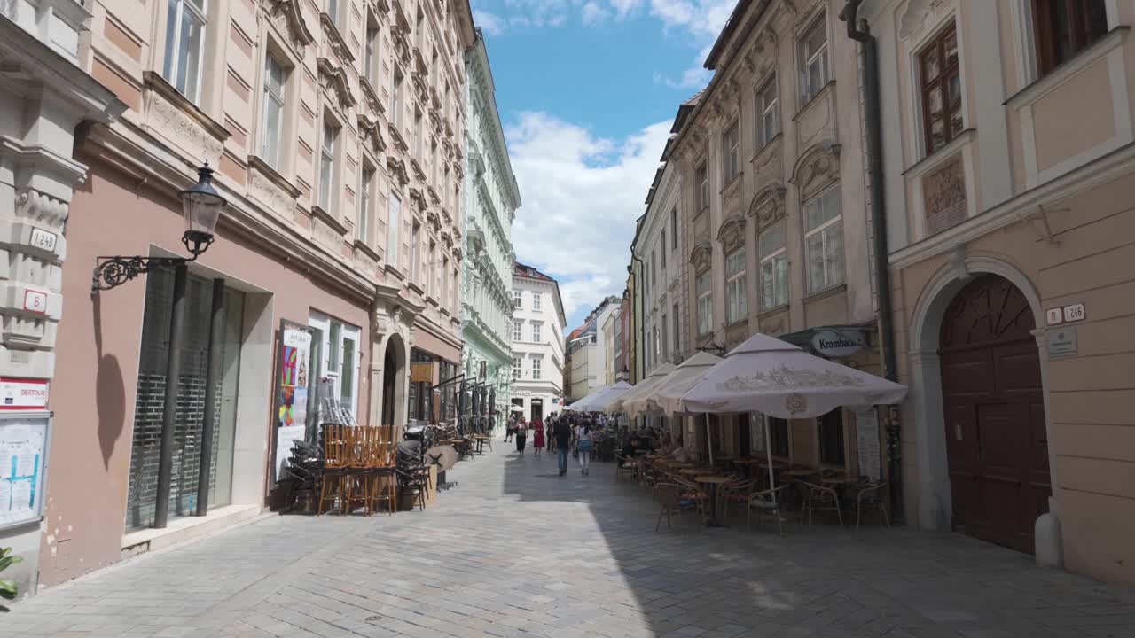 Street view of historic buildings in Bratislava on a clear day with blue skies, Slovakia