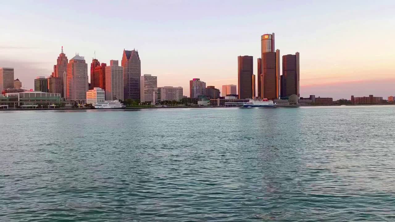 Detroit skyline glows at sunset over the riverfront