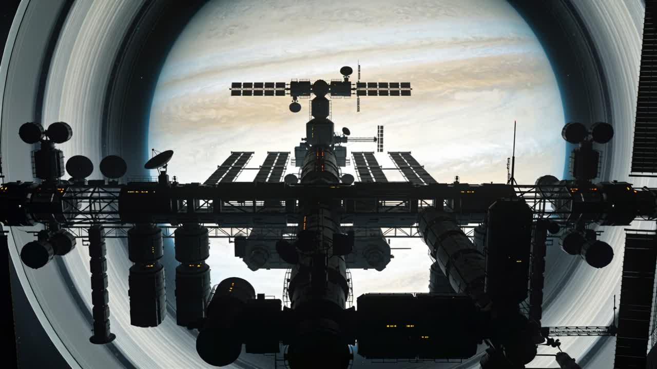 Holding orbital station backlit over ringed giant, camera pulling back revealing rings and arrays