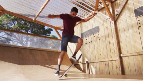 video of middle eastern male skateboarder training in skate park