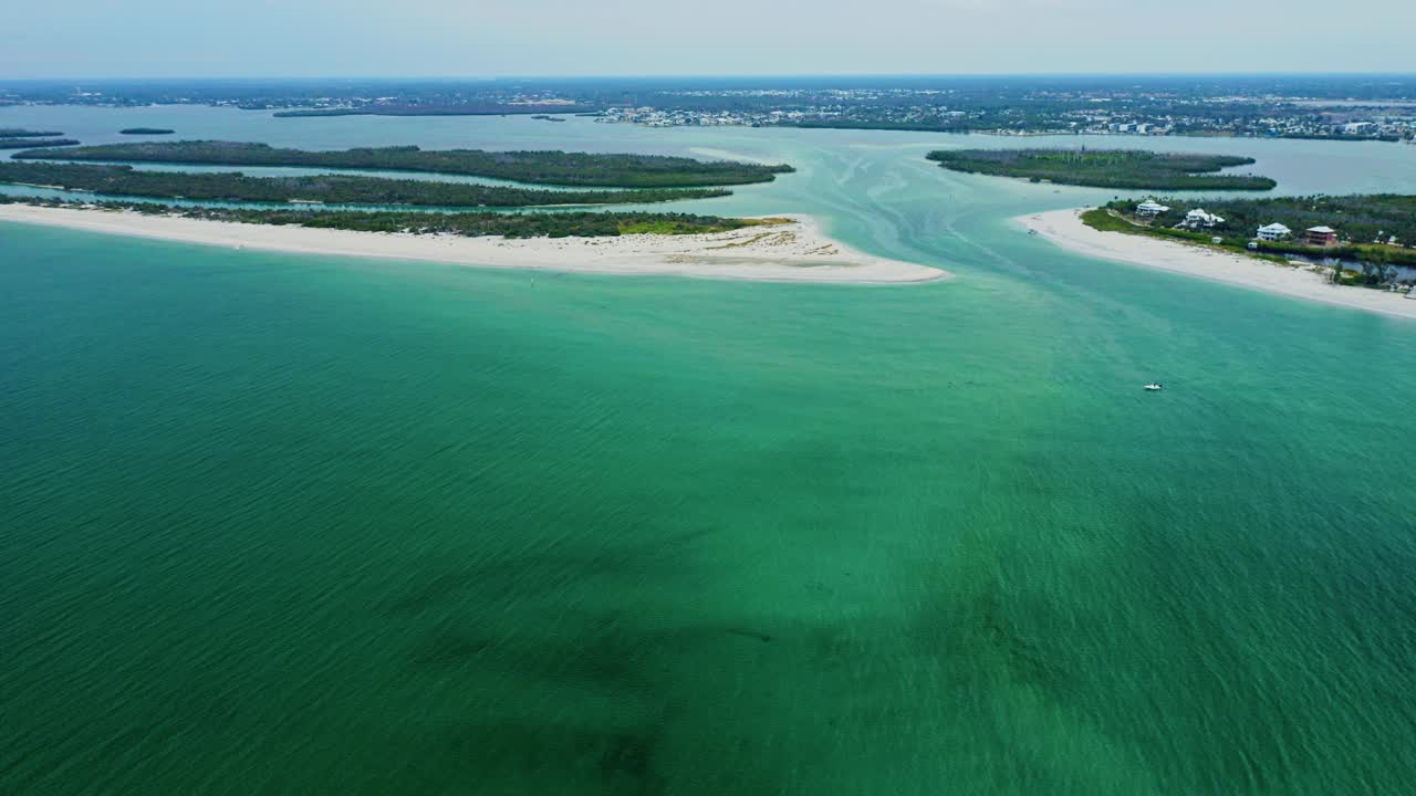Stump Pass opens between sweeping sandbar beaches on Manasota Key along ...