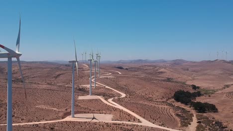 Aerial-footage-forward-and-up-of-eoilic-turbines