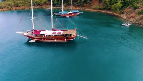 aerial drone flying over the mediterranean sea with sailing boats, yachts in the bay lagoon