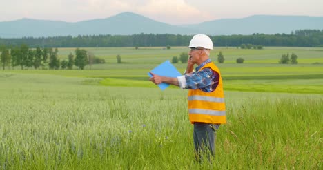 Engineer-Analyzing-Checklist-On-Clipboard-Amidst-Crops-At-Farm-8