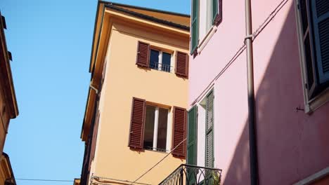 colorful italian townhouses with shutters and balconies