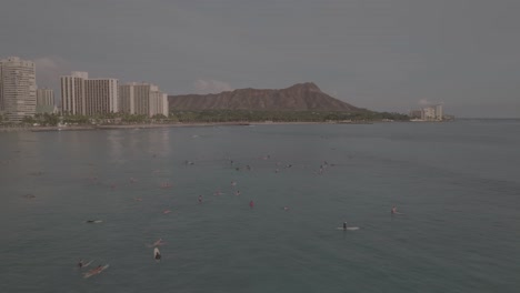 diamond head and surfers, waikiki, honolulu, hawaii. aerial video.