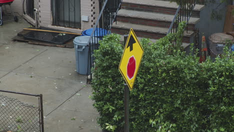 Stop-Ahead-Warning-Sign-Waves-In-The-Wind-During-a-Rainstorm-In-The-Summertime