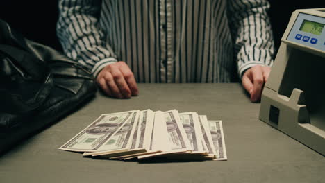 specialised police officer counting dollar banknotes in crime lab, conceptual image. high quality 4k footage
