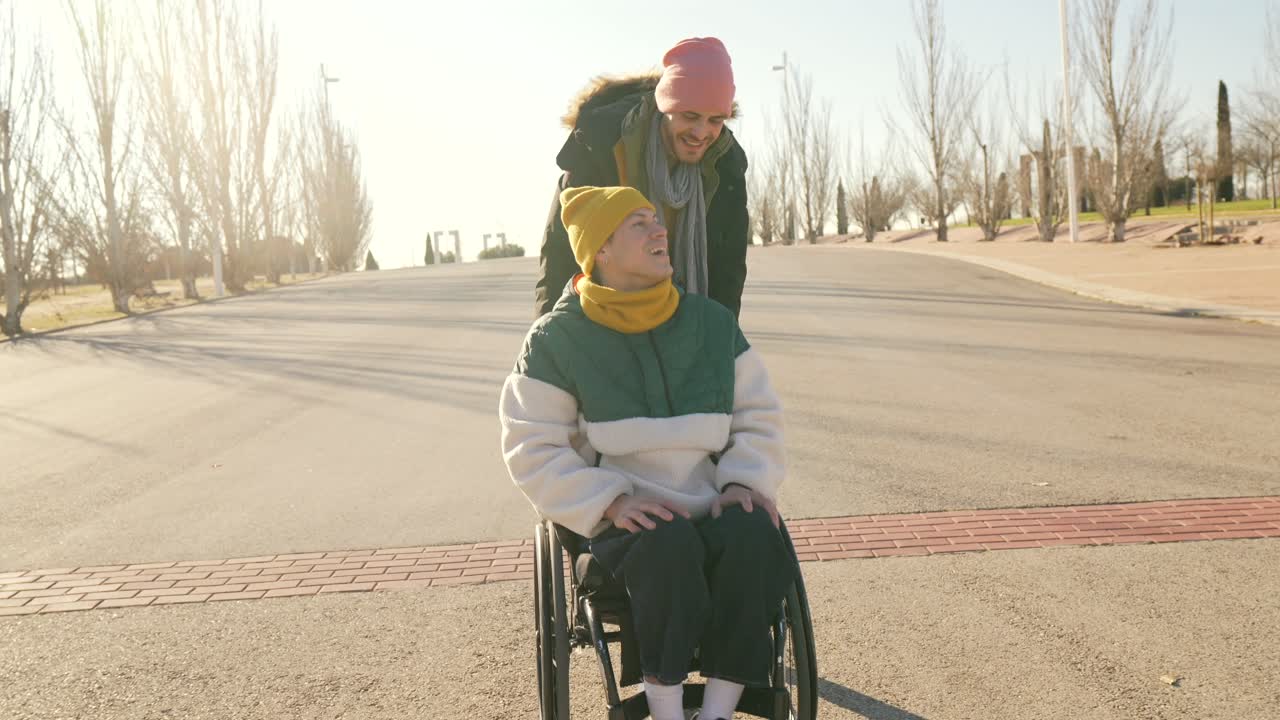 Person pushing another person in a wheelchair