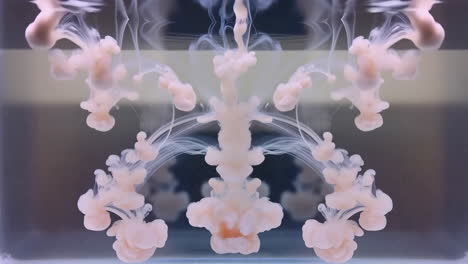 abstract ink diffusion in water with symmetrical organic shapes