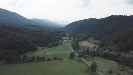 4k drone tilting up from a cloudy valley