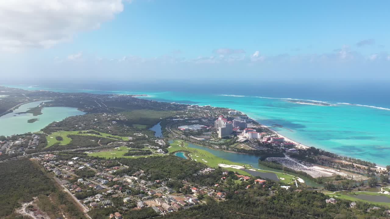 Nassau, Bahamas, Drone Aerial View of Colorful Coastline, Beachfront Buildings, Lagoons and Green Forest