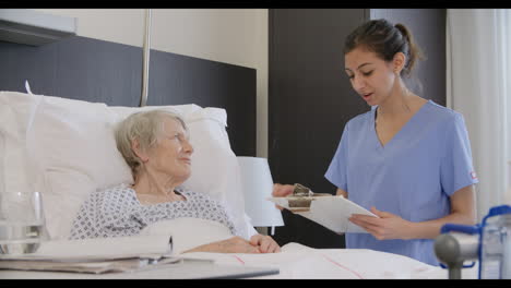 senior patient and medical staff in consultation at hospital