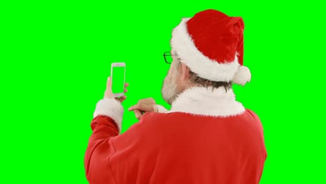 Weihnachtsmann-Benutzt-Mobiltelefon