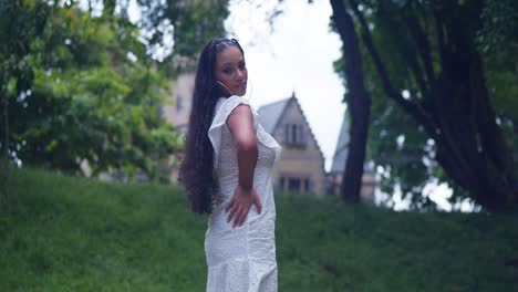 Young-girl-enjoying-a-day-at-the-park-with-a-castle-in-the-background