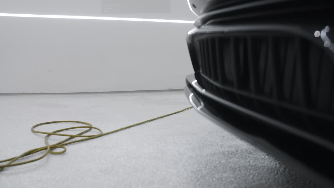 Close-up of a black car's front bumper