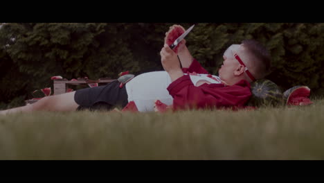 man eating watermelon in a funny way